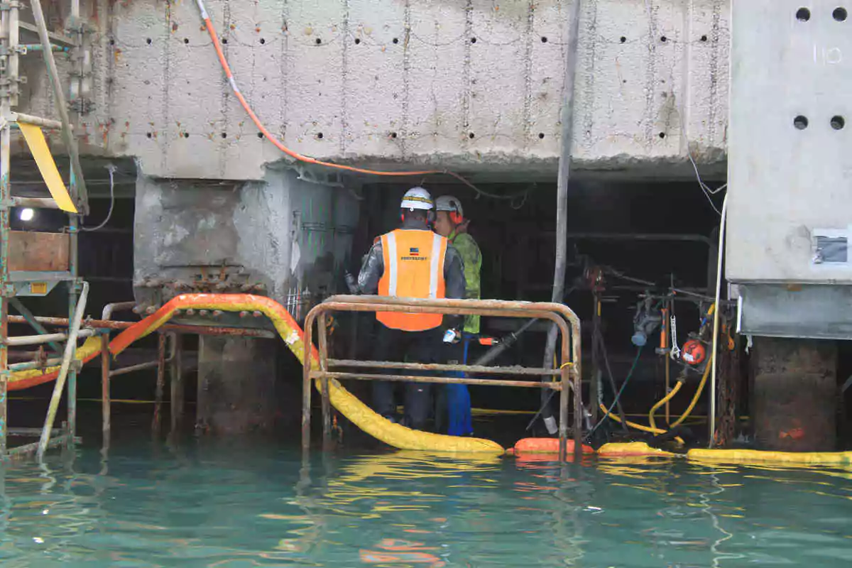 Dock restoration with cathodic protection and containment lining